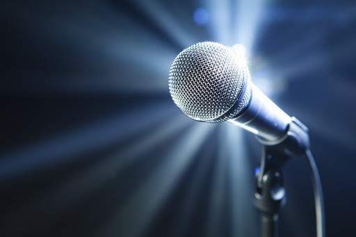 microphone on stage with blue background